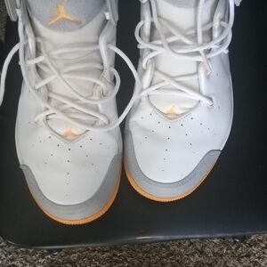 The Air Jordan Melo 1.5 Wolf Grey Mango sneakers in size 10.5